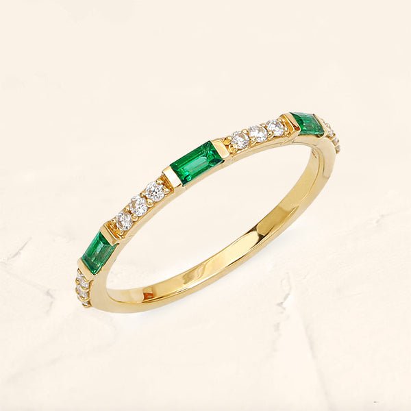 Yellow gold semi eternity emerald baguette and round diamond ring