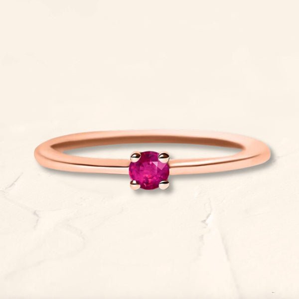 Anillo solitario de oro rosa engastado con un rubí