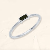 anillo solitario baguette diamante negro en oro blanco
