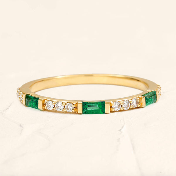 Yellow gold Moksha semi eternity emerald and round diamond wedding ring