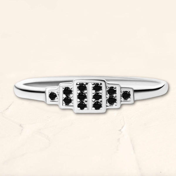 Brami geometric ring in white gold set with black diamonds