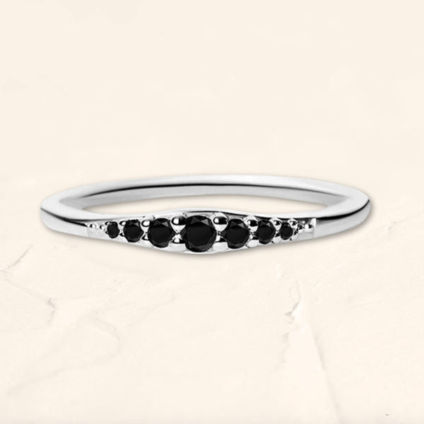 Sushma ring in white gold set with 7 black diamonds