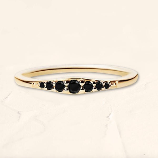 Sushma ring in yellow gold set with 7 black diamonds