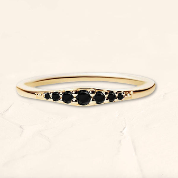 Sushma ring in yellow gold set with 7 black diamonds