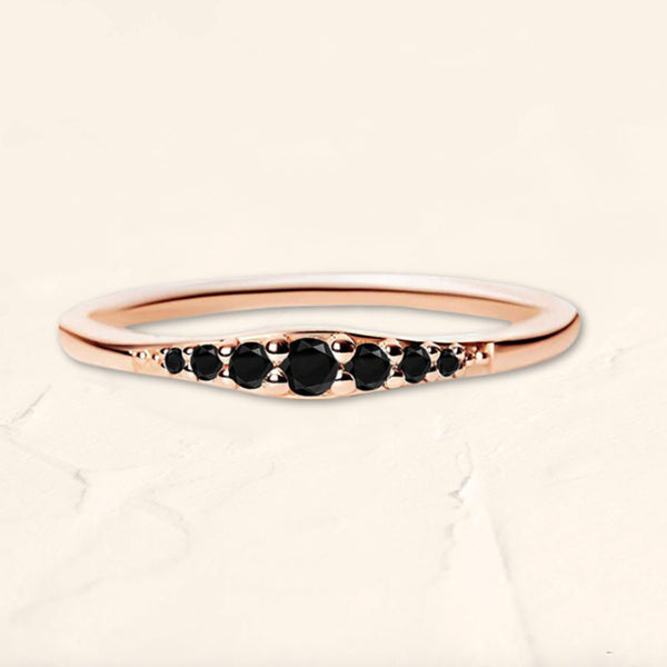 Sushma ring in rose gold set with 7 black diamonds