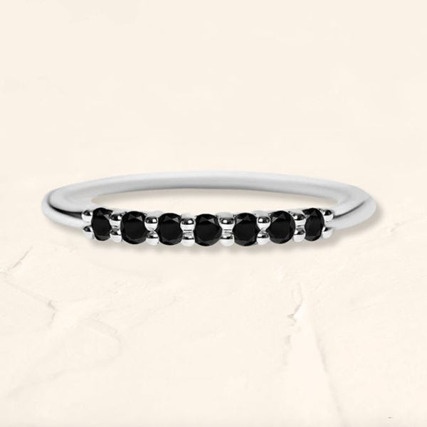 White gold vadha ring set with 7 natural black diamonds