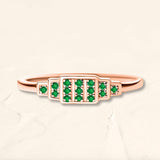 Brami ring in rose gold set with emeralds