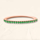 Shadi eternity ring in emerald and rose gold