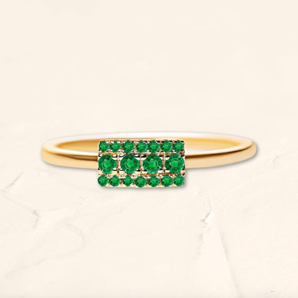 Yellow gold Sapna ring set with emeralds