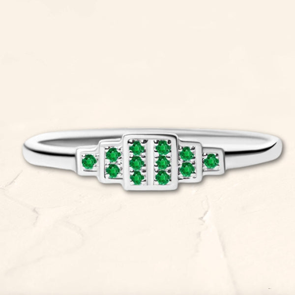 Brami ring in white gold set with emeralds