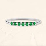 White gold vadha ring set with 7 emeralds