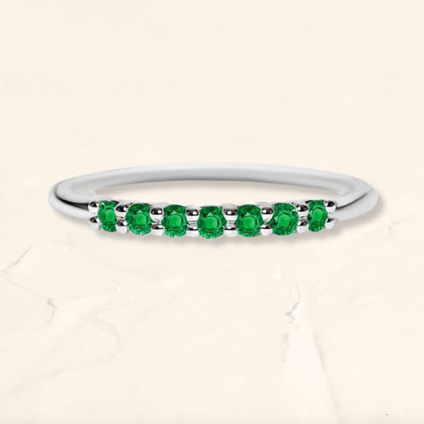 White gold vadha ring set with 7 emeralds