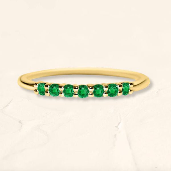 Yellow gold vadha ring set with 7 emeralds