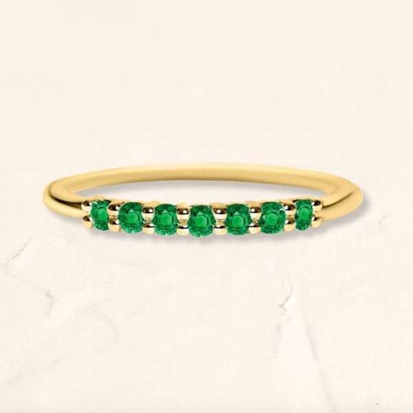 Yellow gold vadha ring set with 7 emeralds