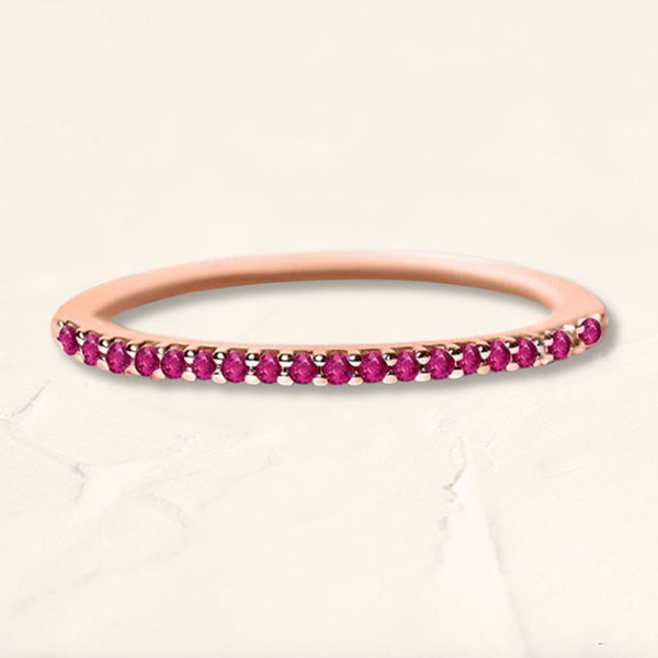 Eternity wedding band paved with rubies and rose gold