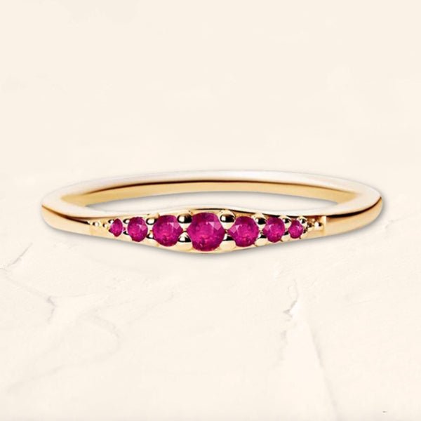 Yellow gold ring with ruby gradations