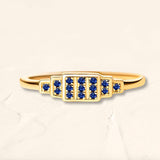 Geometric ring brami XL in yellow gold set with natural sapphires