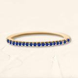 Yellow gold sapphire half circle eternity ring