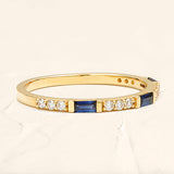 Semi eternity sapphire and round diamond ring in 18 ct yellow gold