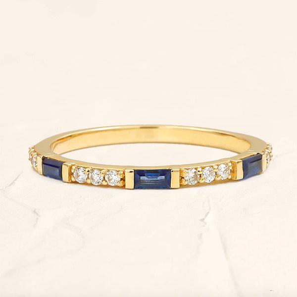 Moksha semi eternity ring with sapphire and round diamond in yellow gold