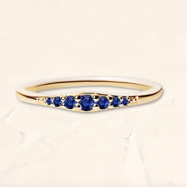 Yellow gold Sushma ring set with sapphires