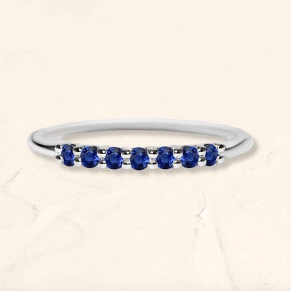 White gold vadha ring set with 7 sapphires