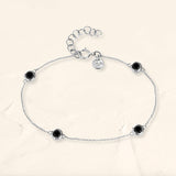 Black diamond bezel bracelet in white gold