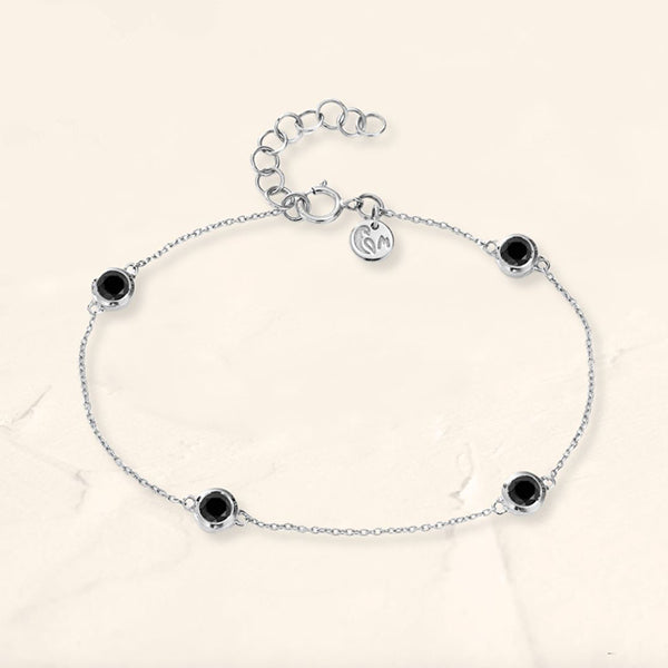 Black diamond bezel bracelet in white gold