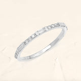 Semi eternity baguette ring with round diamond in 18 ct white gold