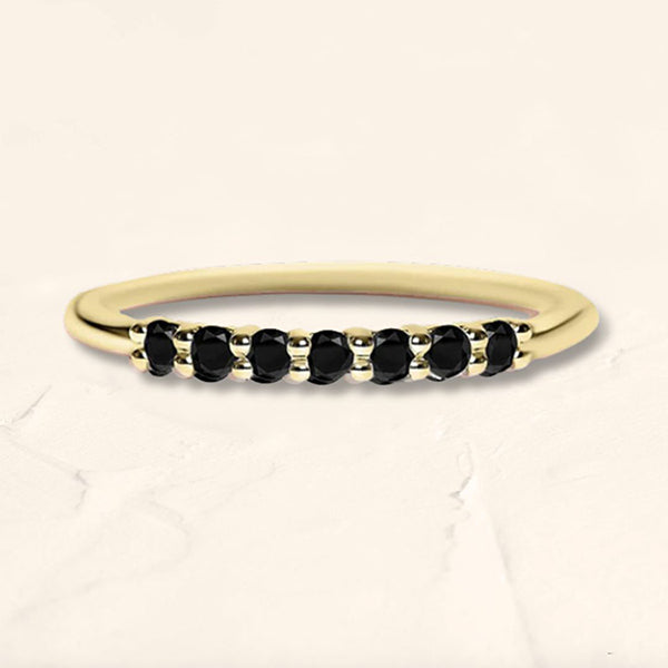 Yellow gold vadha ring set with 7 natural black diamonds