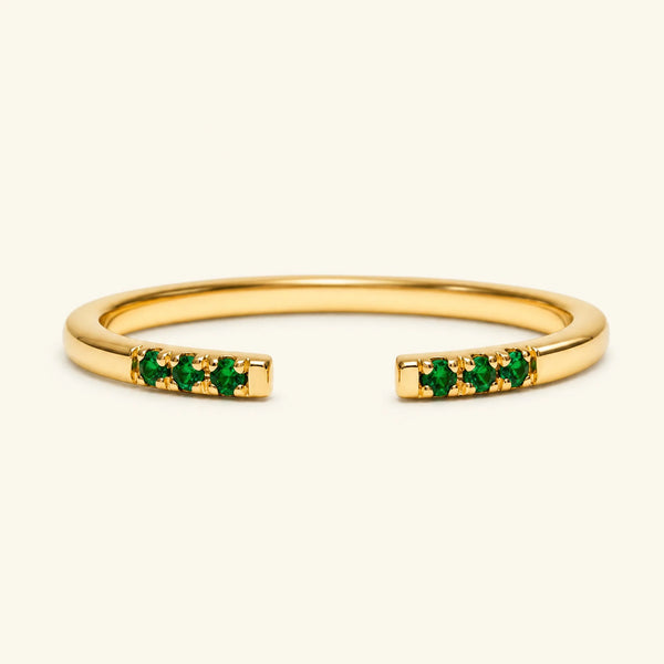 Bague ouverte fine pavée d'émeraudes en or jaune