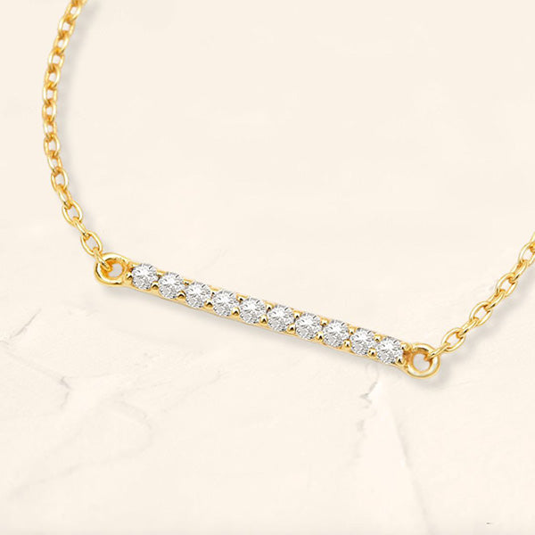 pulsera larga con barra de diamantes en oro amarillo