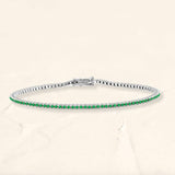 Bracelet tennis rivière émeraude en or blanc 18cts