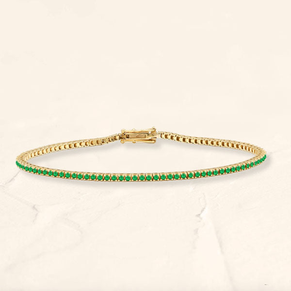 Tennis bracelet emerald river in yellow gold 18cts