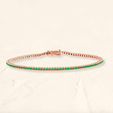 Bracelet tennis rivière émeraude en or rose 18cts