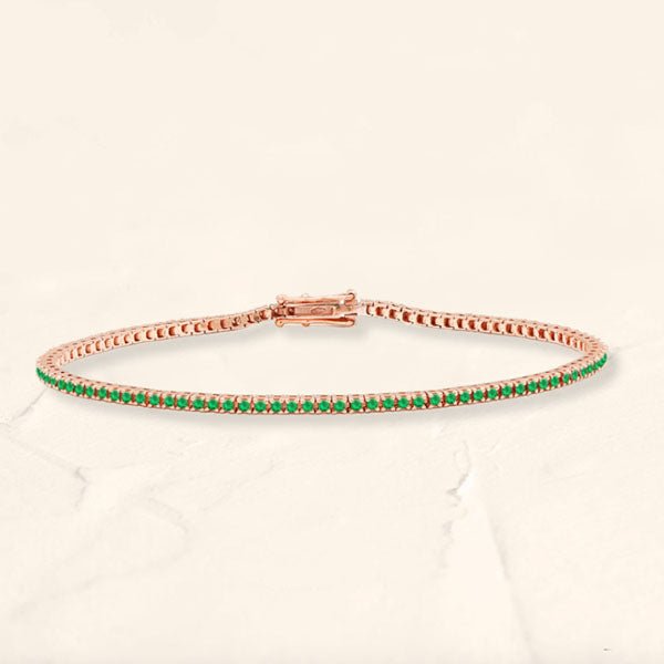 Bracelet tennis rivière émeraude en or rose 18cts