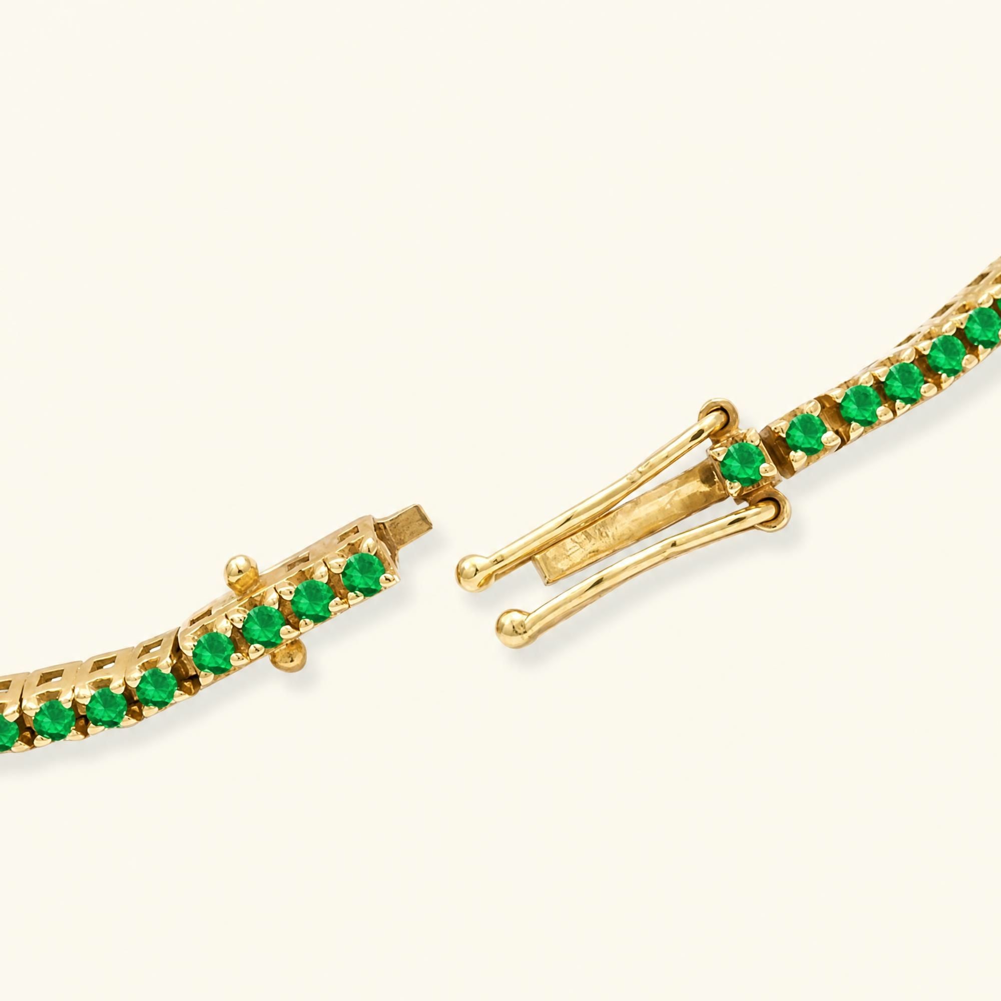 Bracelet tennis Ganga émeraude en or jaune 18cts avec double loquet de sécurité