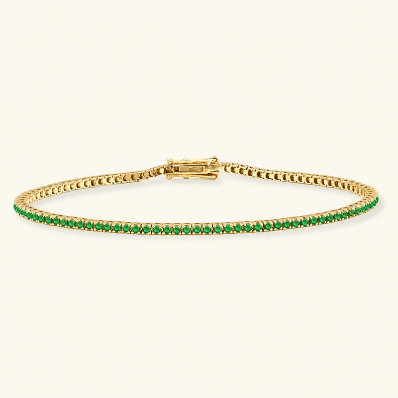Bracelet tennis rivière émeraude en or jaune 18cts