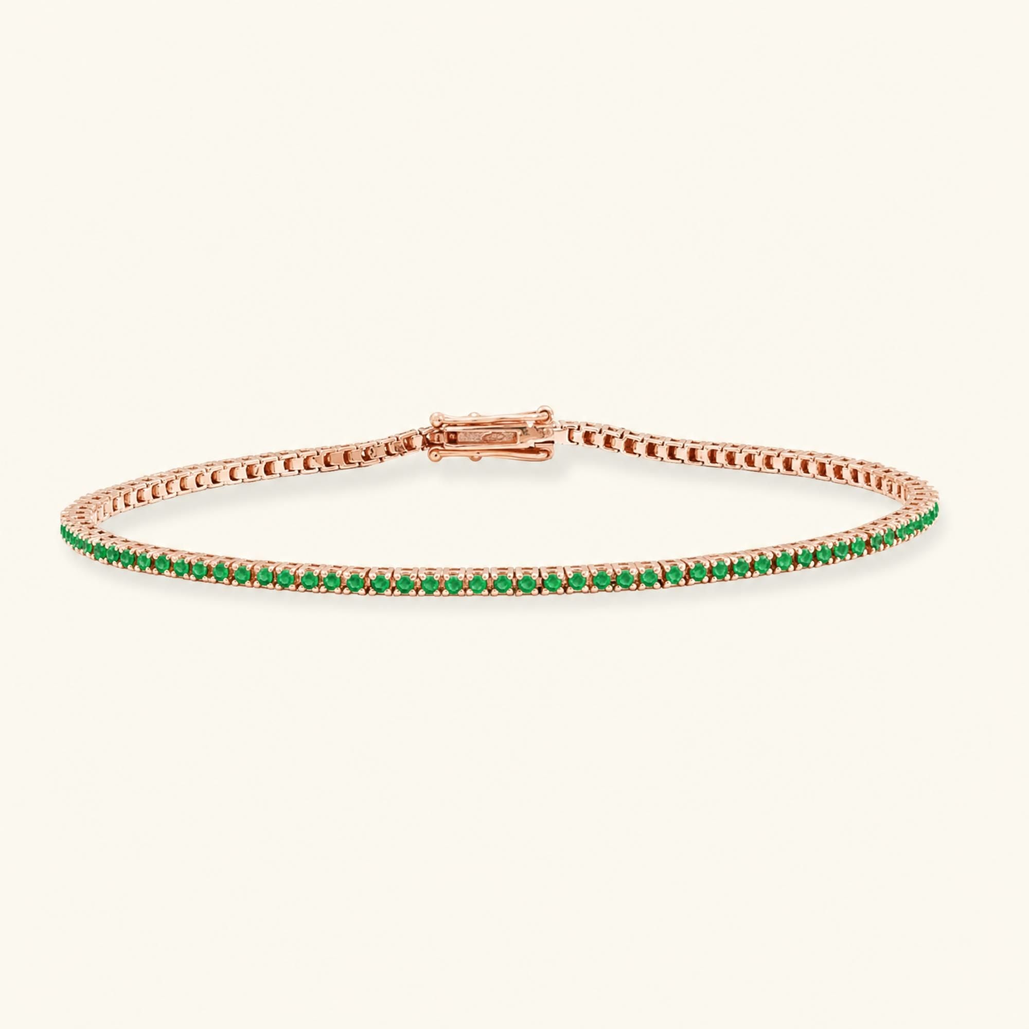 Bracelet tennis rivière émeraude en or rose 18cts