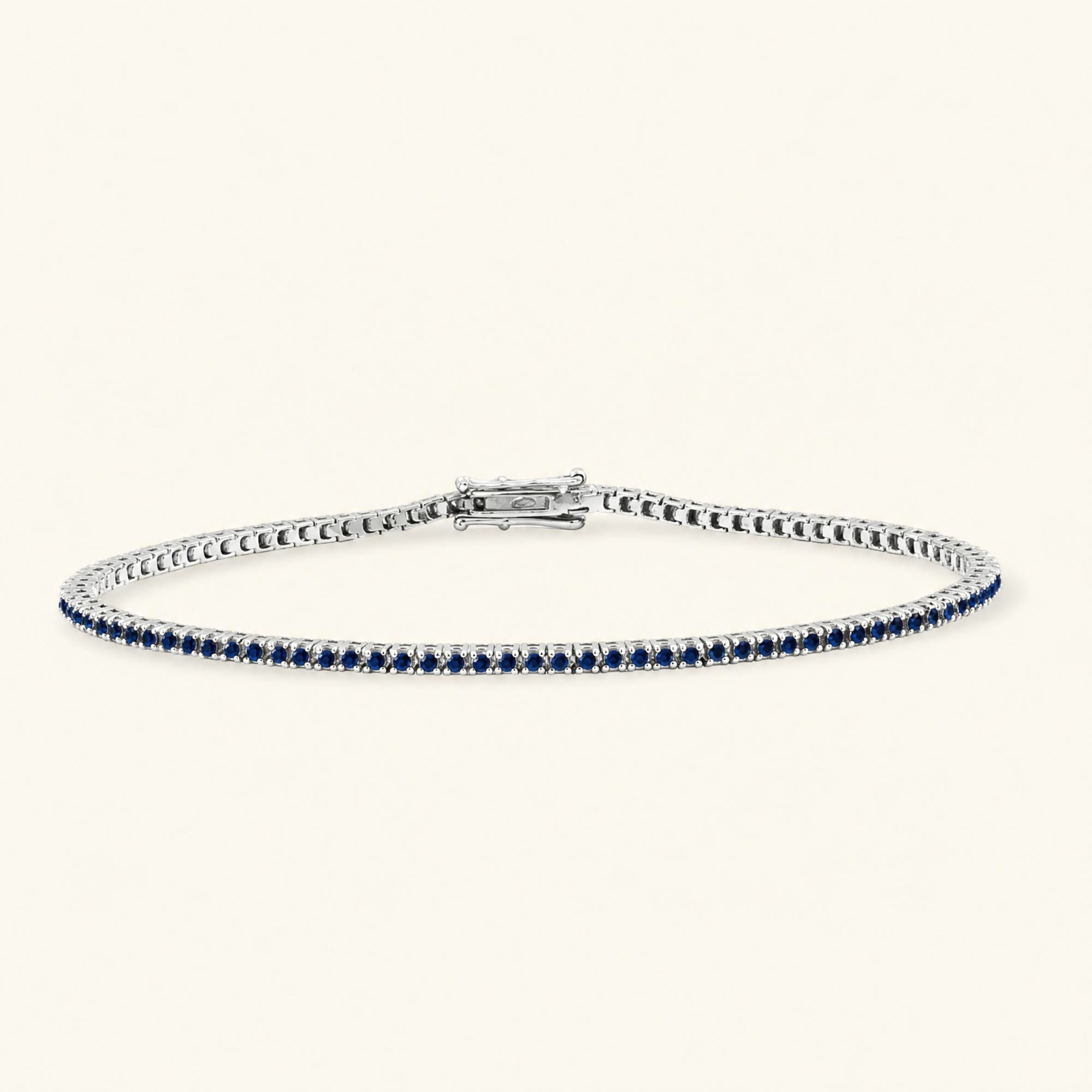 Bracelet tennis rivière en saphir et or blanc 18cts