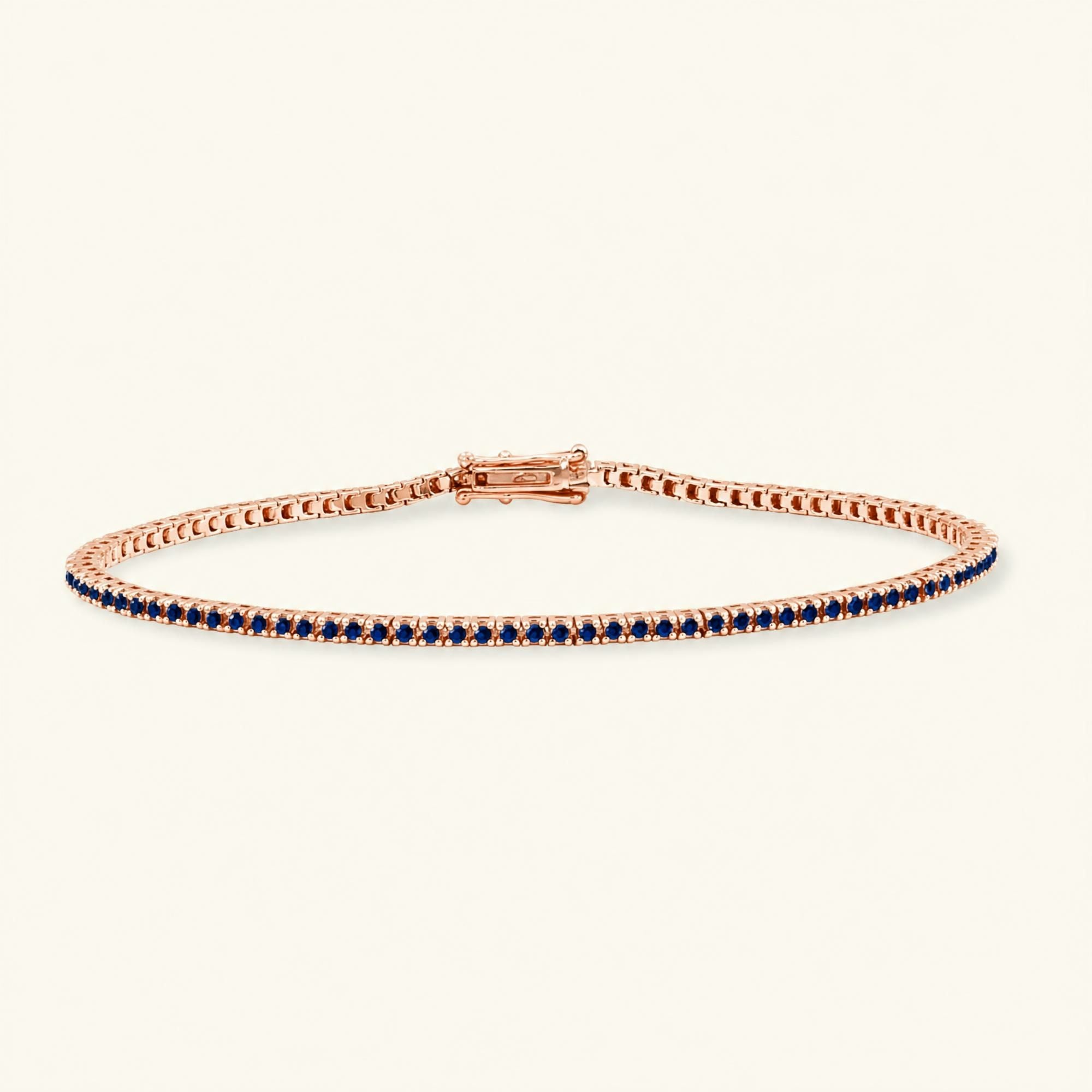 Bracelet tennis rivière en saphir et or rose 18cts