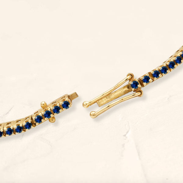 Tennis bracelet Ganga in sapphire and yellow gold 18cts