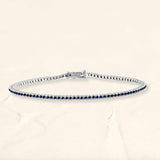 Bracelet tennis rivière en saphir et or blanc 18cts