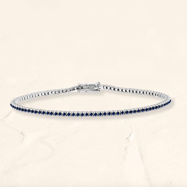 Bracelet tennis rivière en saphir et or blanc 18cts