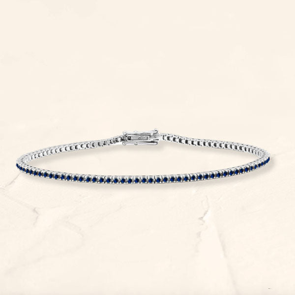 Bracelet tennis rivière en saphir et or blanc 18cts