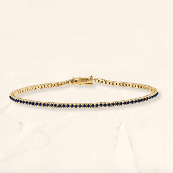 Bracelet tennis rivière en saphir et or jaune 18cts