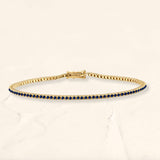 Sapphire and 18ct yellow gold tennis bracelet