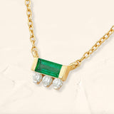 Prana emerald and diamond baguette necklace in yellow gold