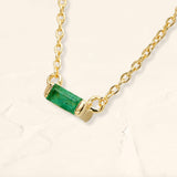 Shanti emerald baguette necklace in yellow gold side view