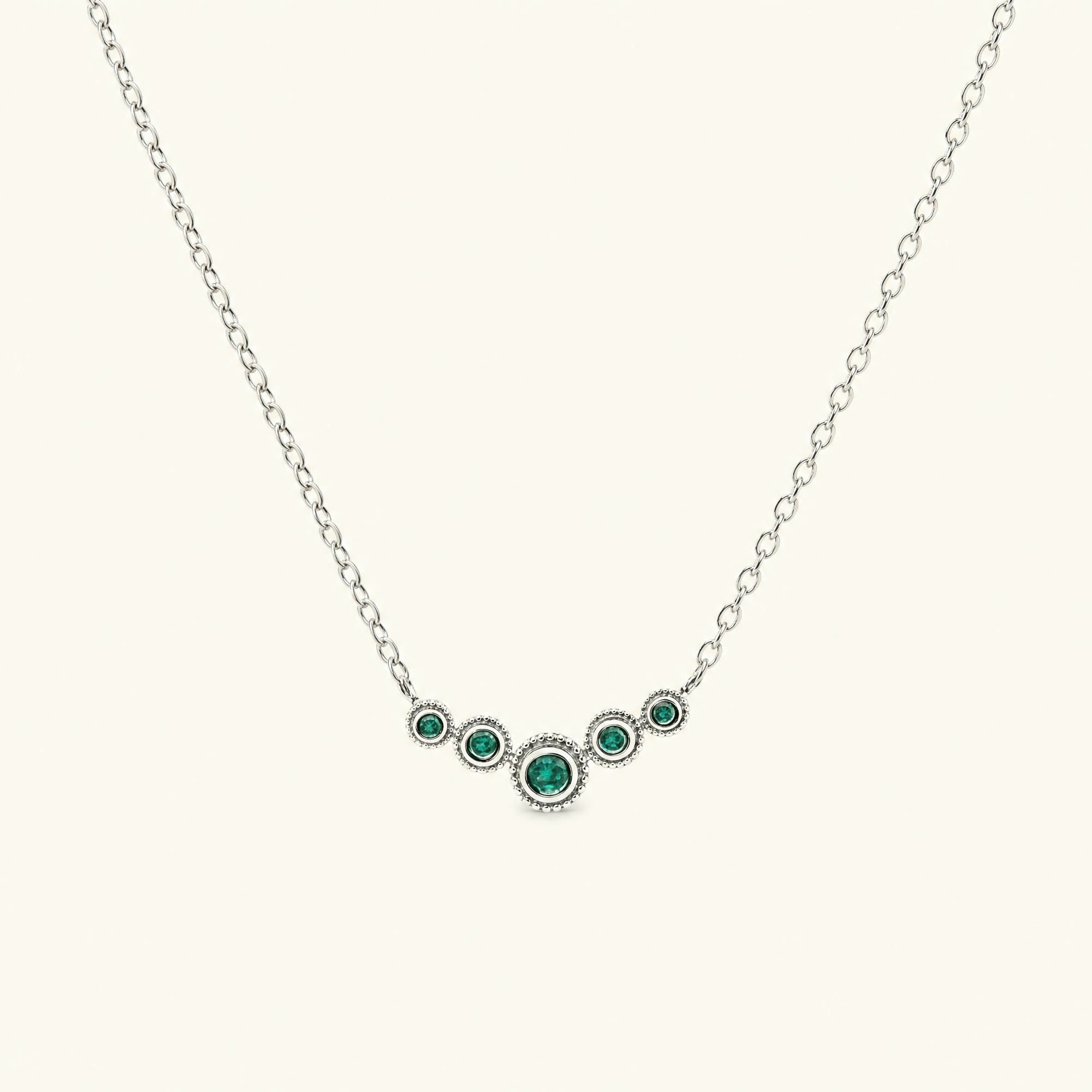 Collier fin rivière d'émeraudes en or blanc